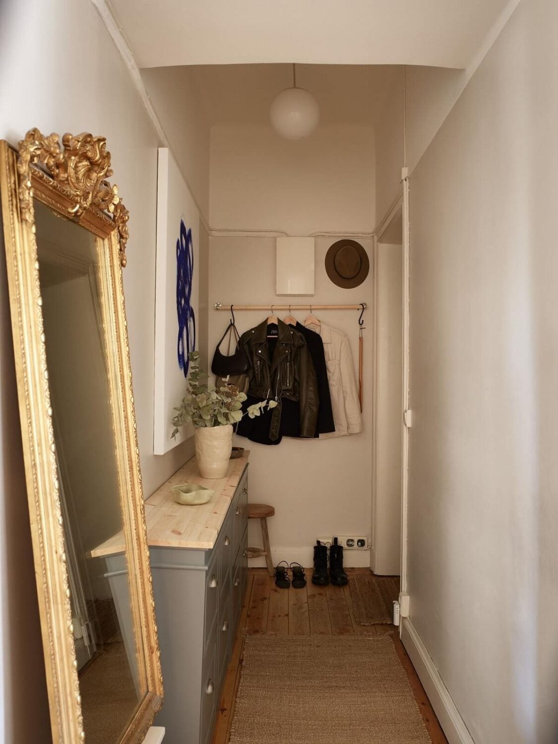 Period Features and Light Colors in a One-Bedroom Apartment 17 hallway with narrow cabinets