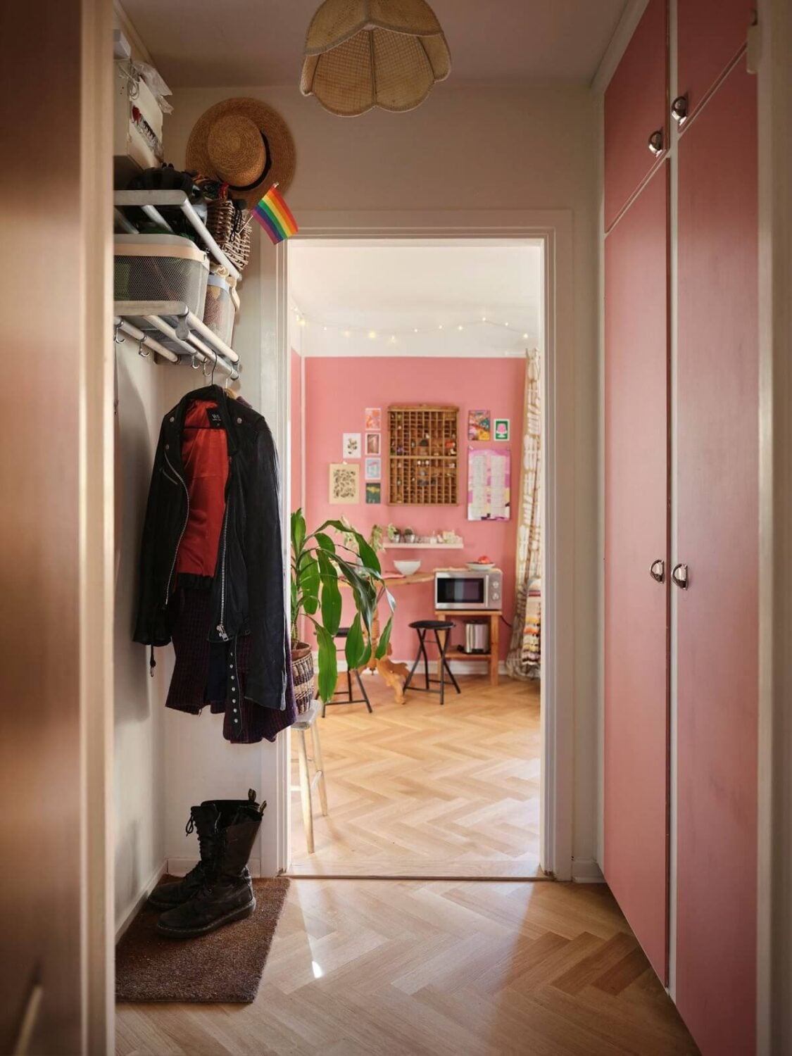 A Bold Pink Studio Apartment with a Light Yellow Kitchen 14 hallway with pink built in cabinets