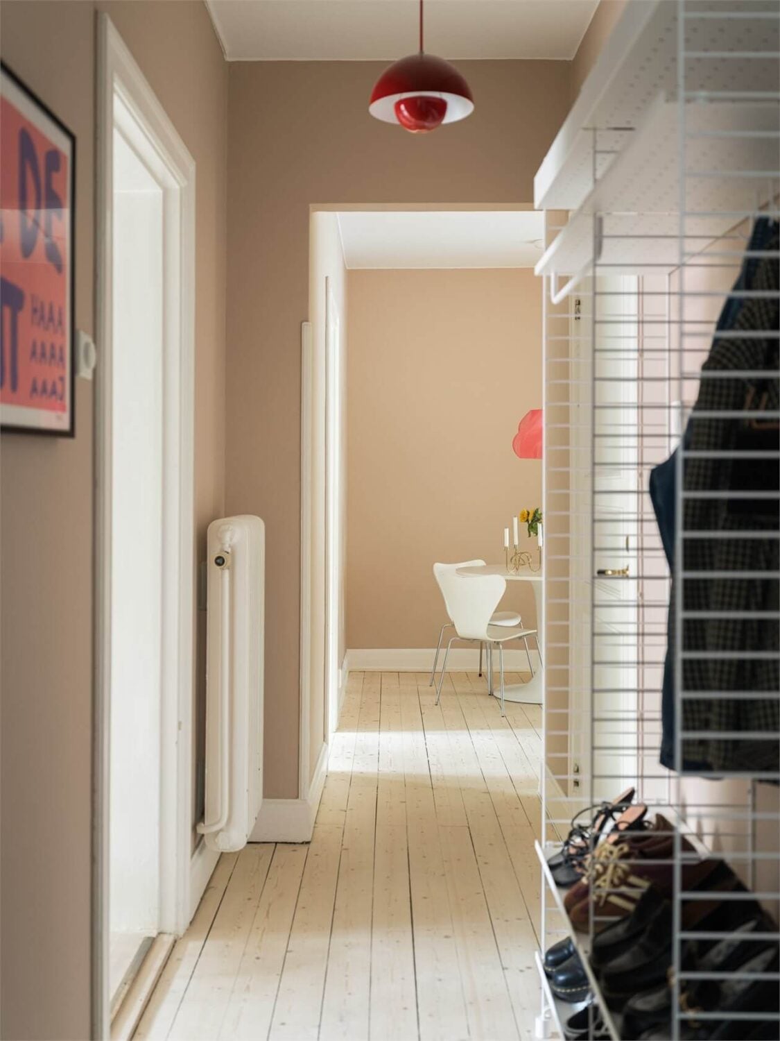Colorful and Light Rooms in a Swedish One-Bedroom Apartment 16 hallway with pink walls