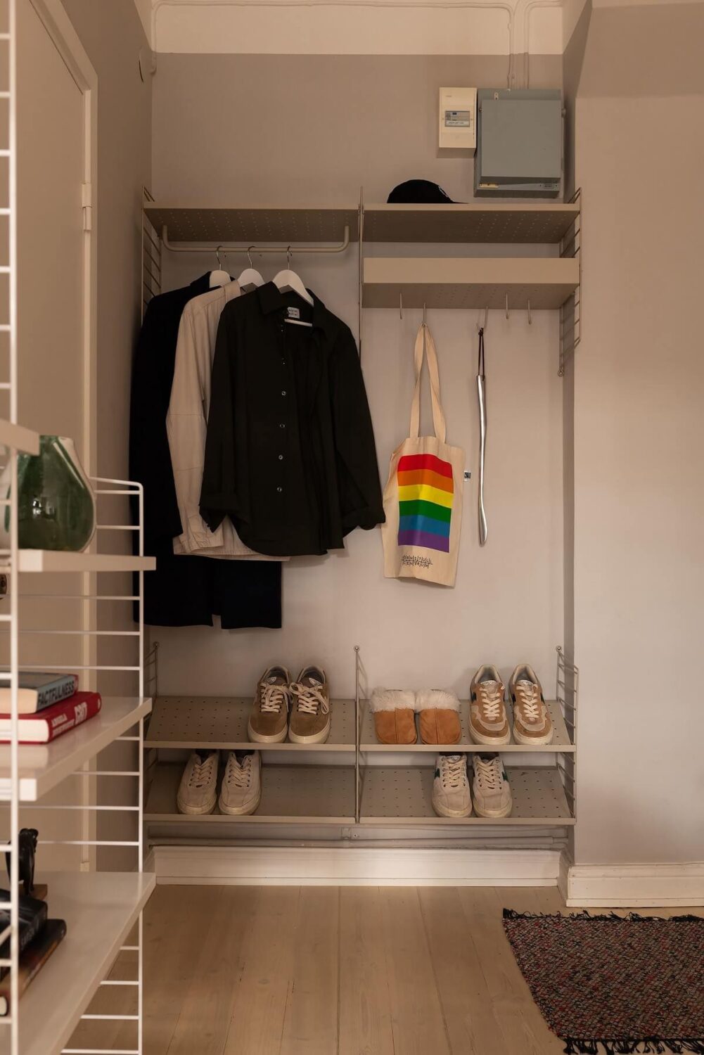 Sober Colors in a Small Renovated Stockholm Apartment 19 hallway with storage