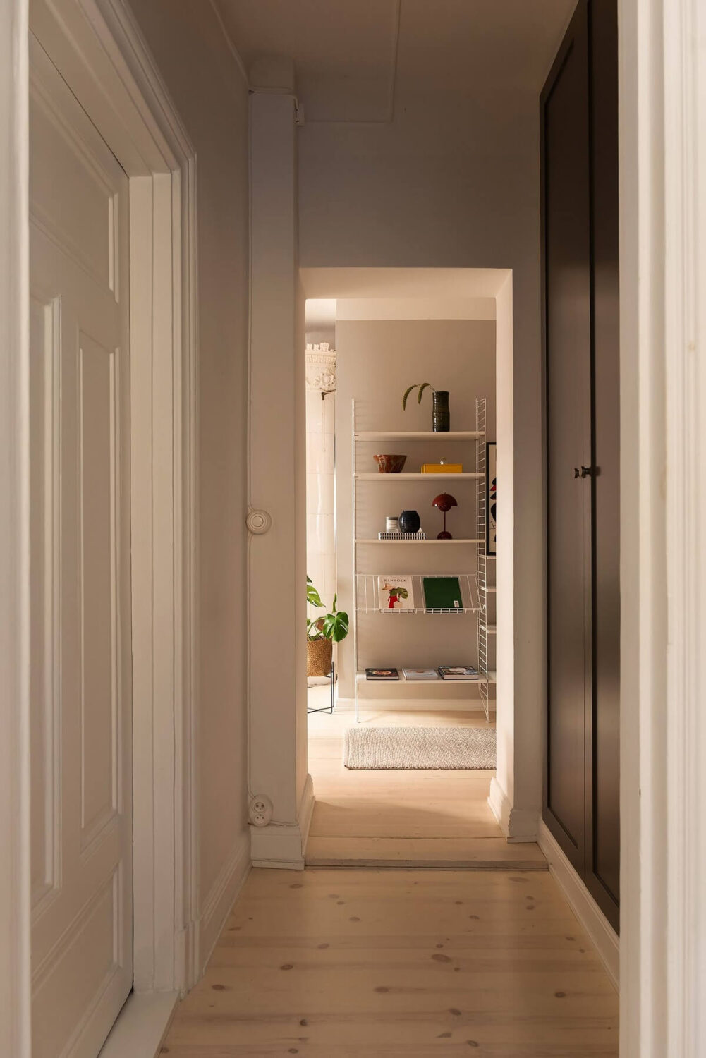 Sober Colors in a Small Renovated Stockholm Apartment 14 hallway with wardrobes