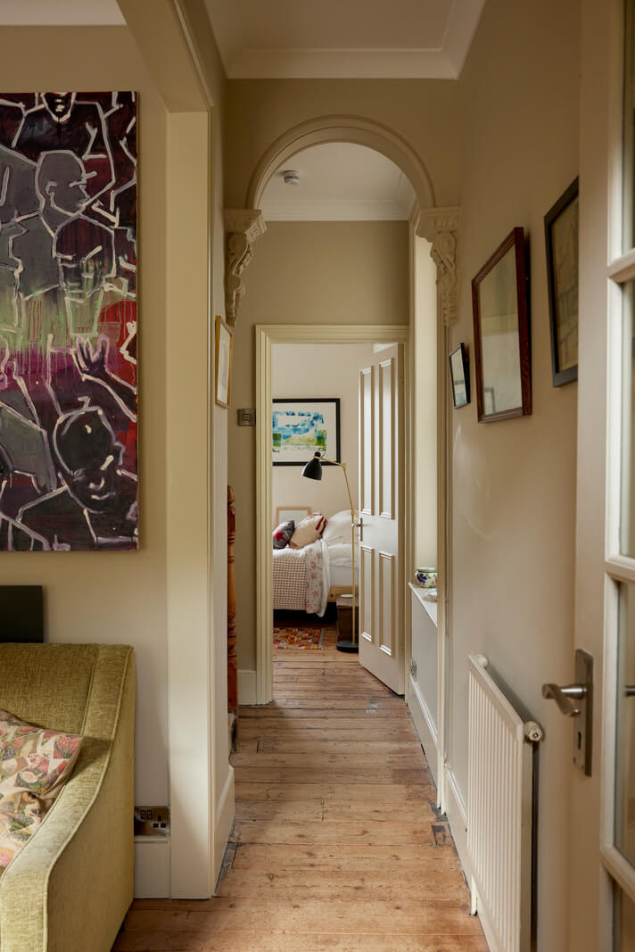Muted Tones and an Orangery in a Victorian Coastal House 7 hallway with wooden floor