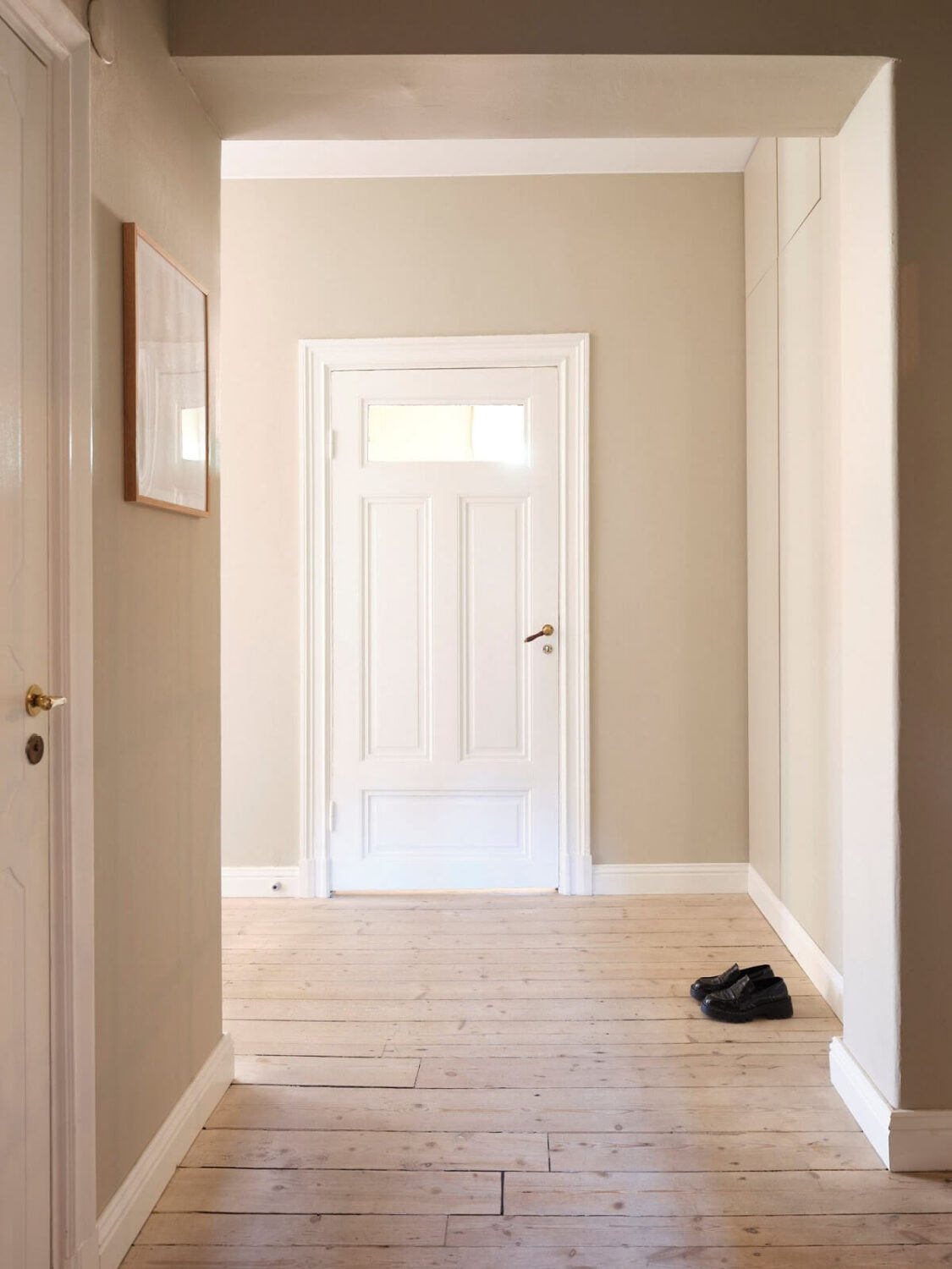 A Light Pastel Yellow and Pink Apartment in Stockholm 27 hallway wooden floor A Light Pastel Yellow and Pink Apartment in Stockholm