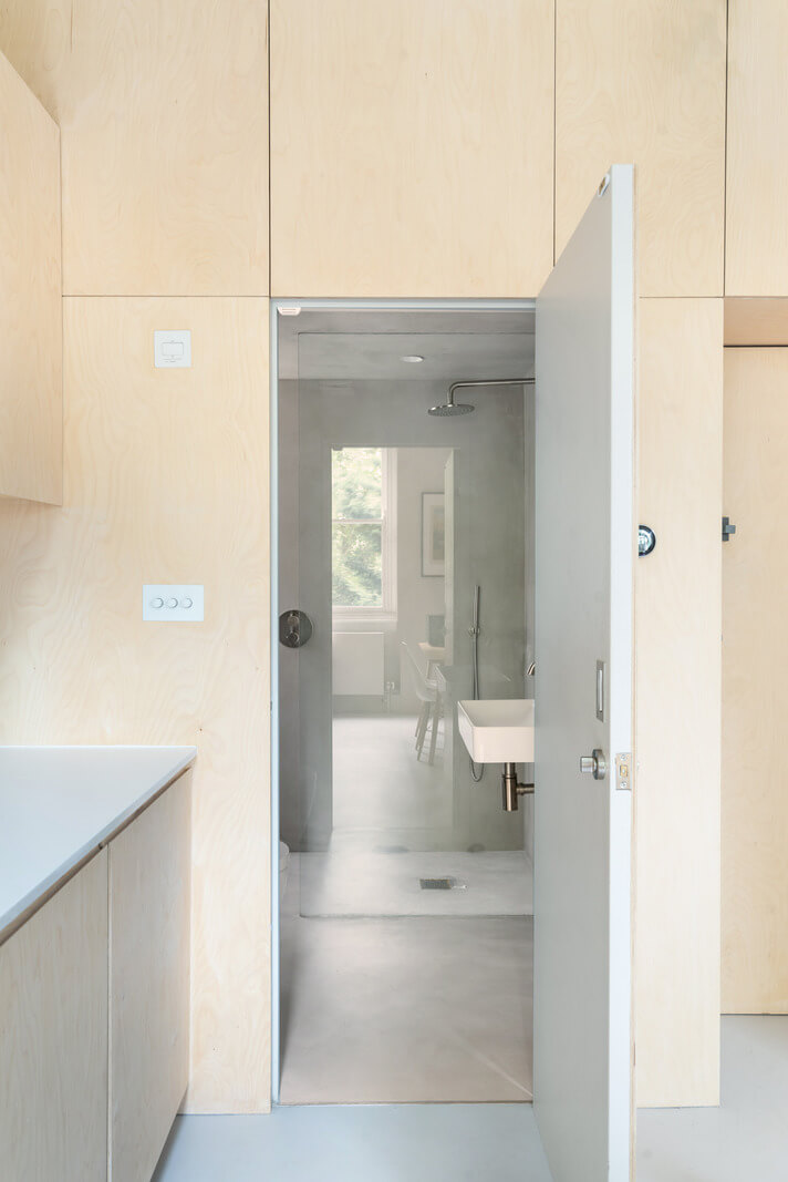 An Award-Winning Shoji-Inspired Loft Apartment in London 8 hidden door to bathroom