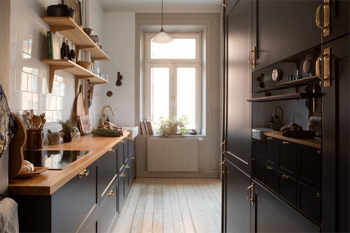A Turn-of-the-Century Apartment with a Dark Blue Bedroom - Revisited 15 kitchen blue cabinets wooden countertop
