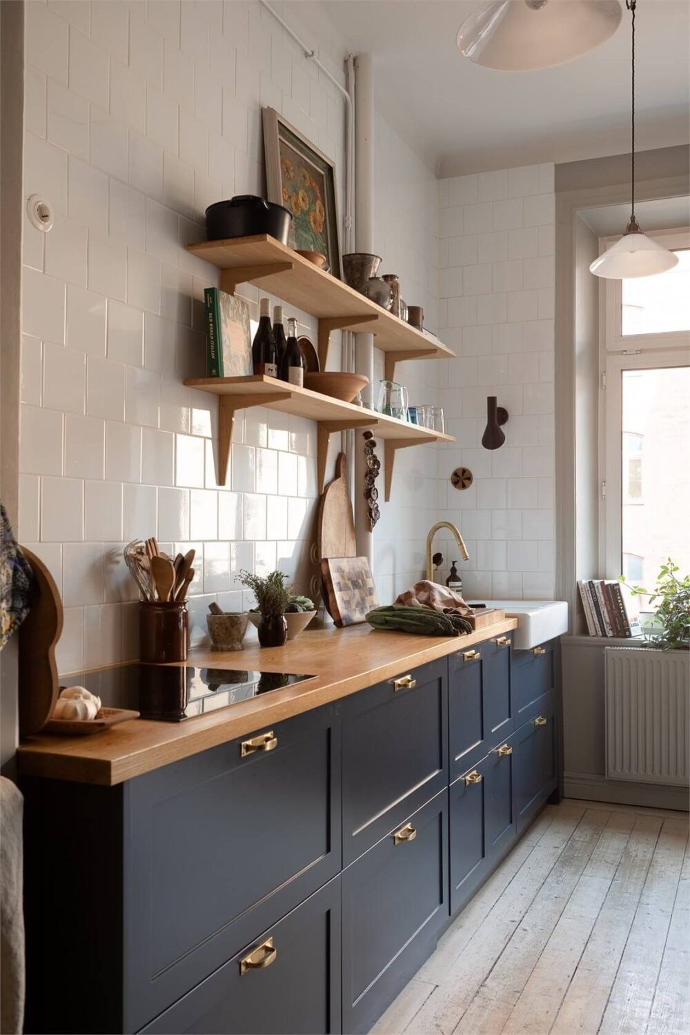 A Turn-of-the-Century Apartment with a Dark Blue Bedroom - Revisited 13 kitchen dark blue cabinets wooden worktop