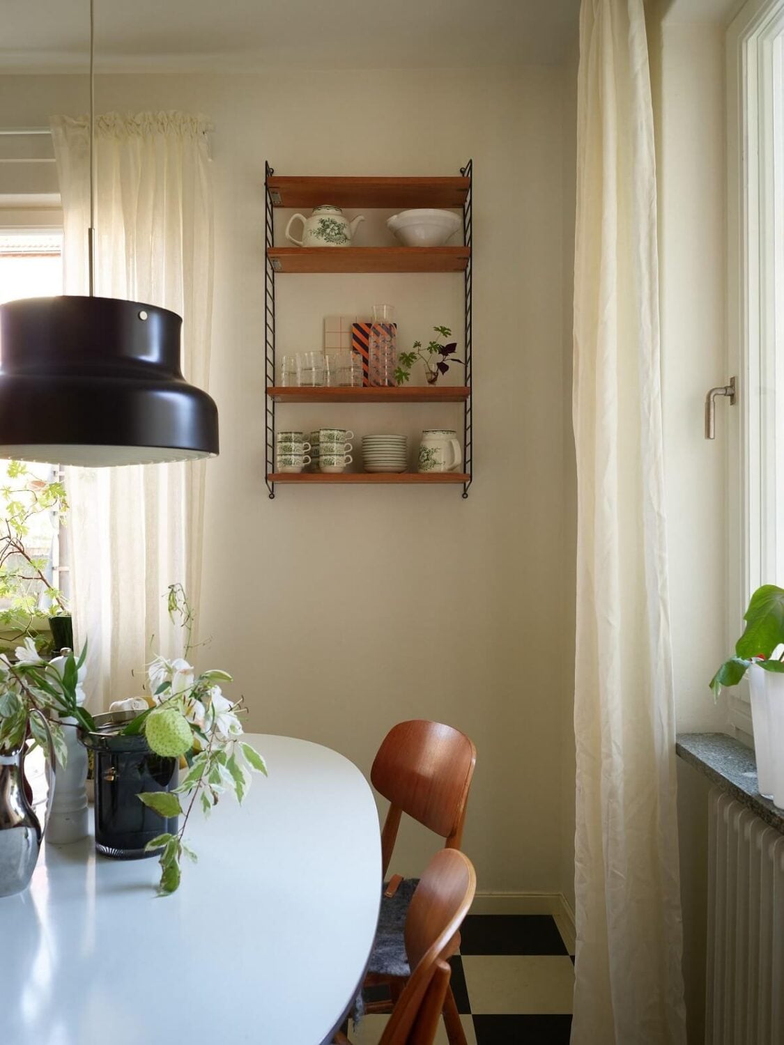 Preserved Midcentury Details and a Red Bedroom in a Stockholm Apartment 14 kitchen dining table