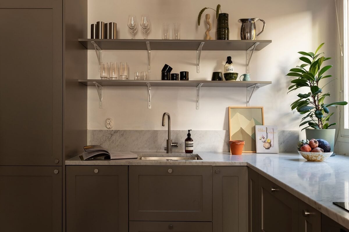 Sober Colors in a Small Renovated Stockholm Apartment 10 kitchen gray cabinets shelves