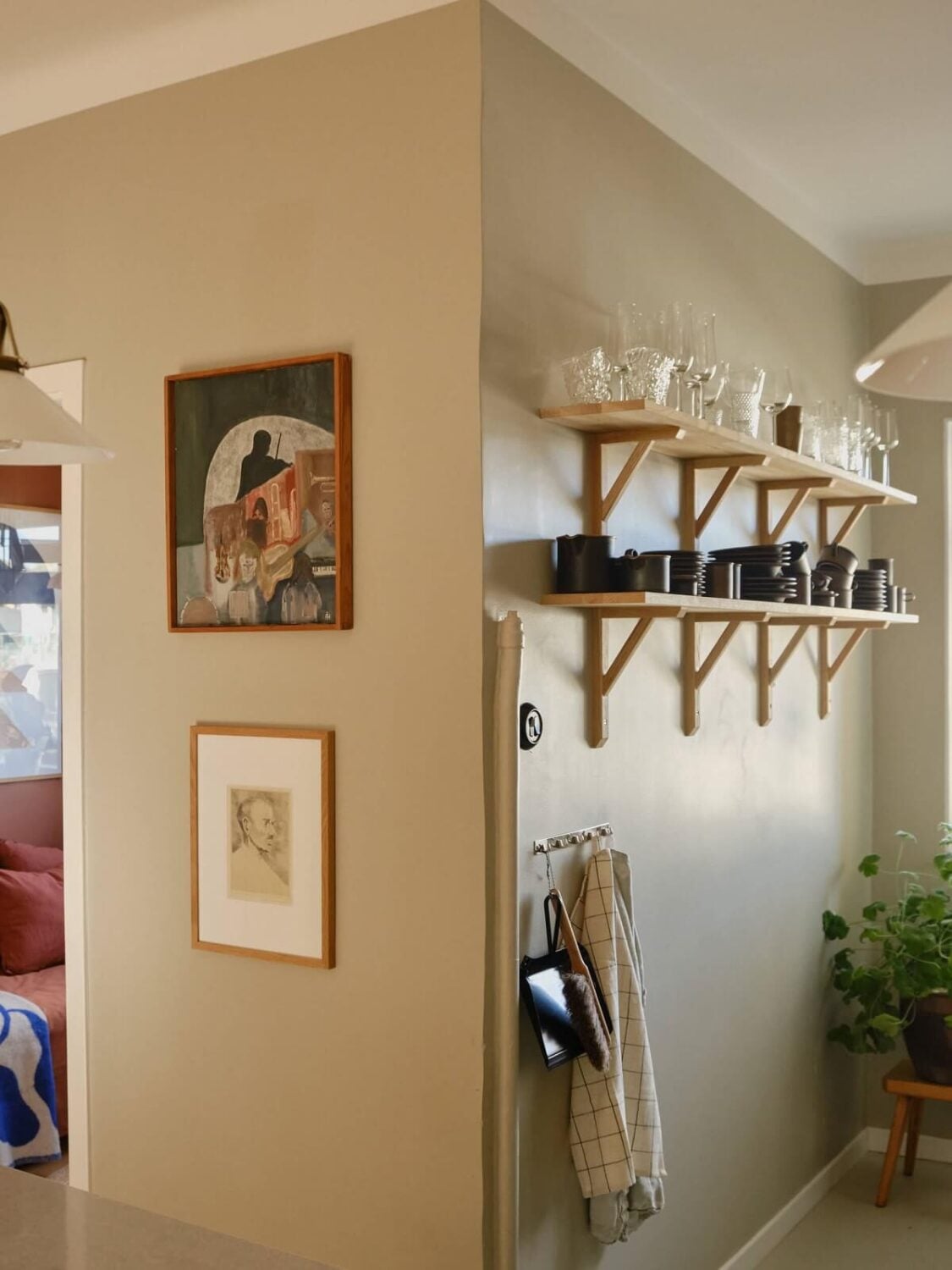 A Beautiful Calm and Natural Apartment with a Green Kitchen 11 kitchen shelves gray wall