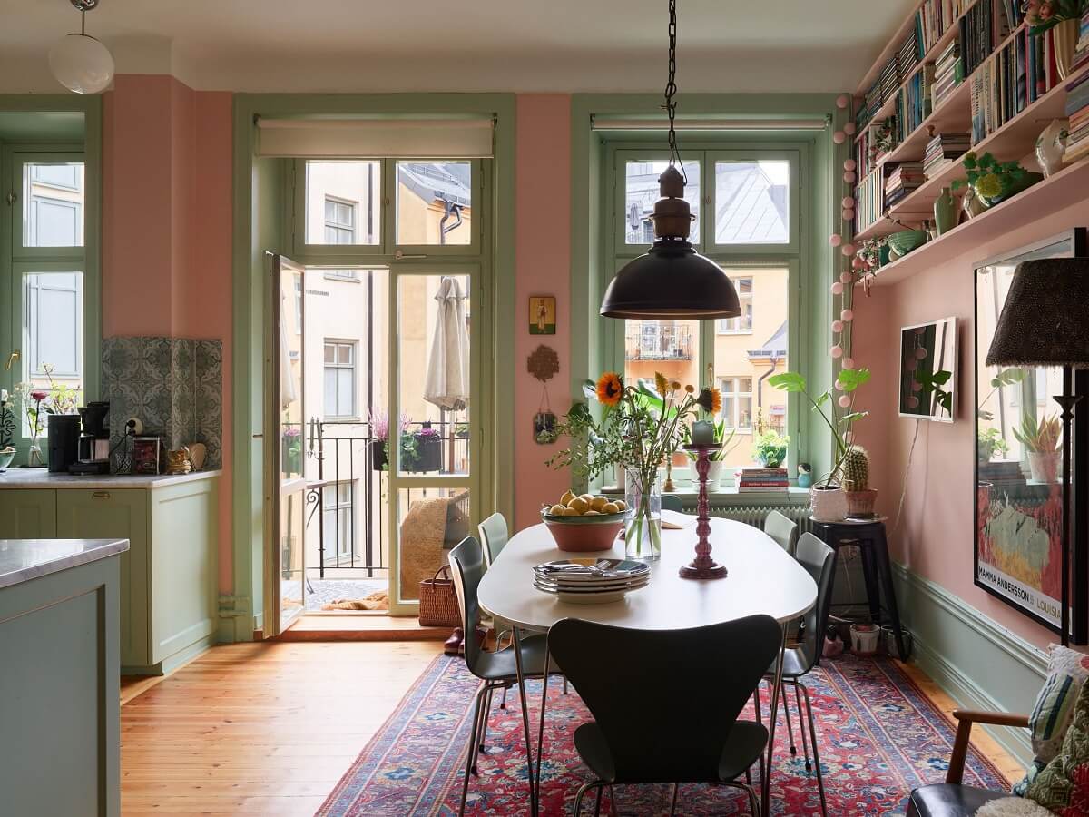 kitchen table pink walls green joinery