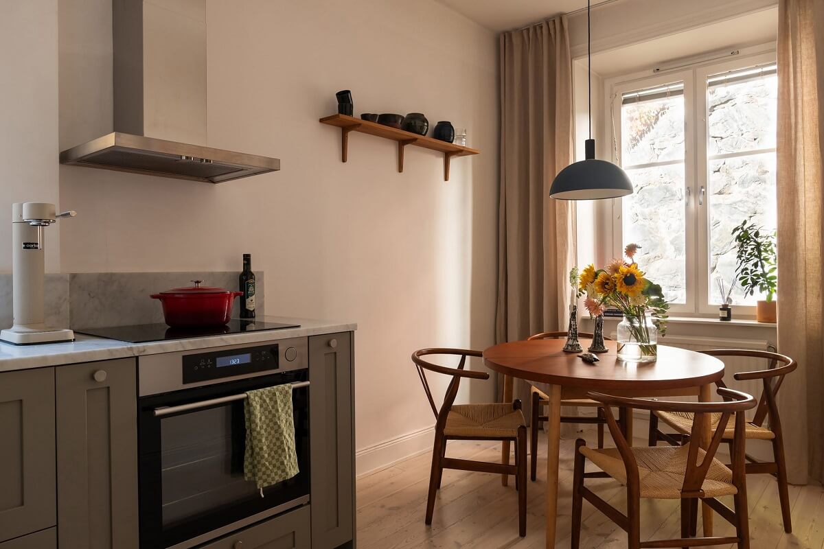 Sober Colors in a Small Renovated Stockholm Apartment 12 kitchen with round table