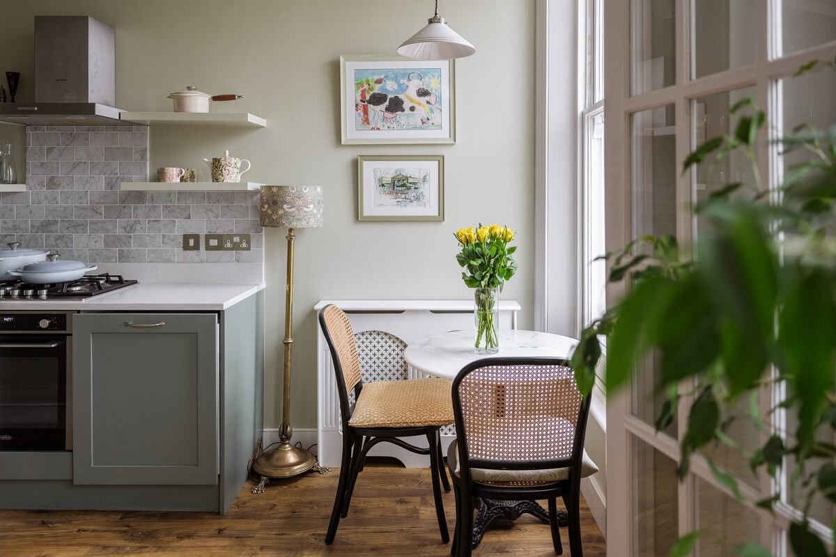 A Beautiful One-Bedroom Apartment with Plants and Period Features 5 kitchen with small round table in front of window