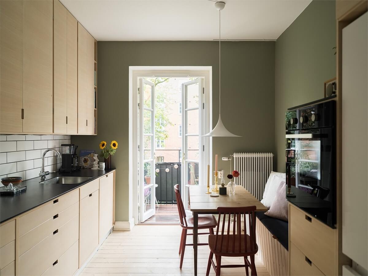 Valspar Color of the Year 2026: Warm Eucalyptus 7 kitchen with wooden cabinets and sage green walls