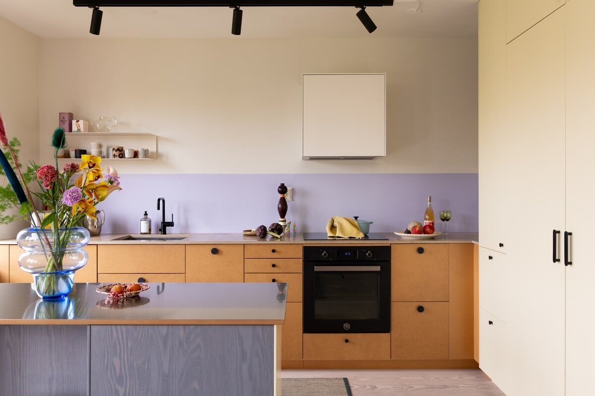 A Light and Modern Stockholm Apartment with Cheerful Color Accents 2 lavender color accent modern scandinavian kitchen