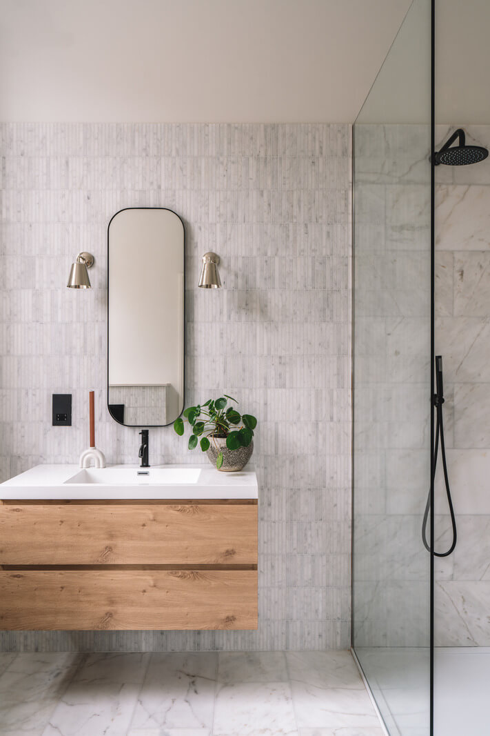 Contemporary Interiors with Limewash Walls in an Old School Building 17 light bathroom with wooden vanity