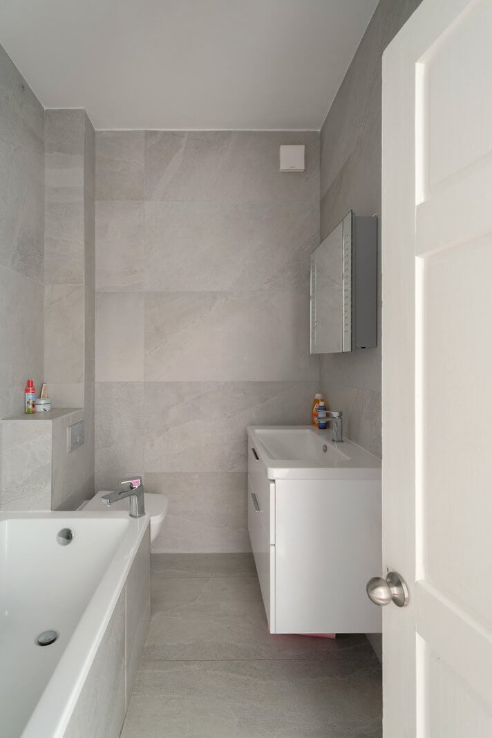 A Colorful Gothic-Style School Conversion in England 17 light gray bathroom