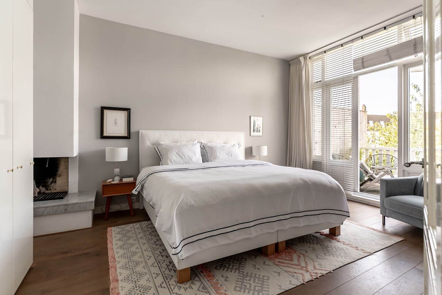 A Beautiful Monumental Villa with Green Color Accents 16 light gray bedroom with balcony