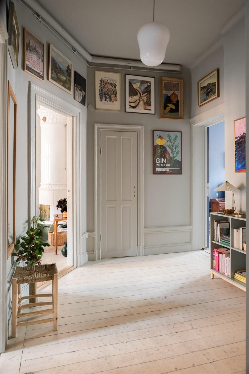 A Turn-of-the-Century Apartment with a Dark Blue Bedroom - Revisited 25 light gray hall with art A Turn-of-the-Century Apartment with a Dark Blue Bedroom - Revisited