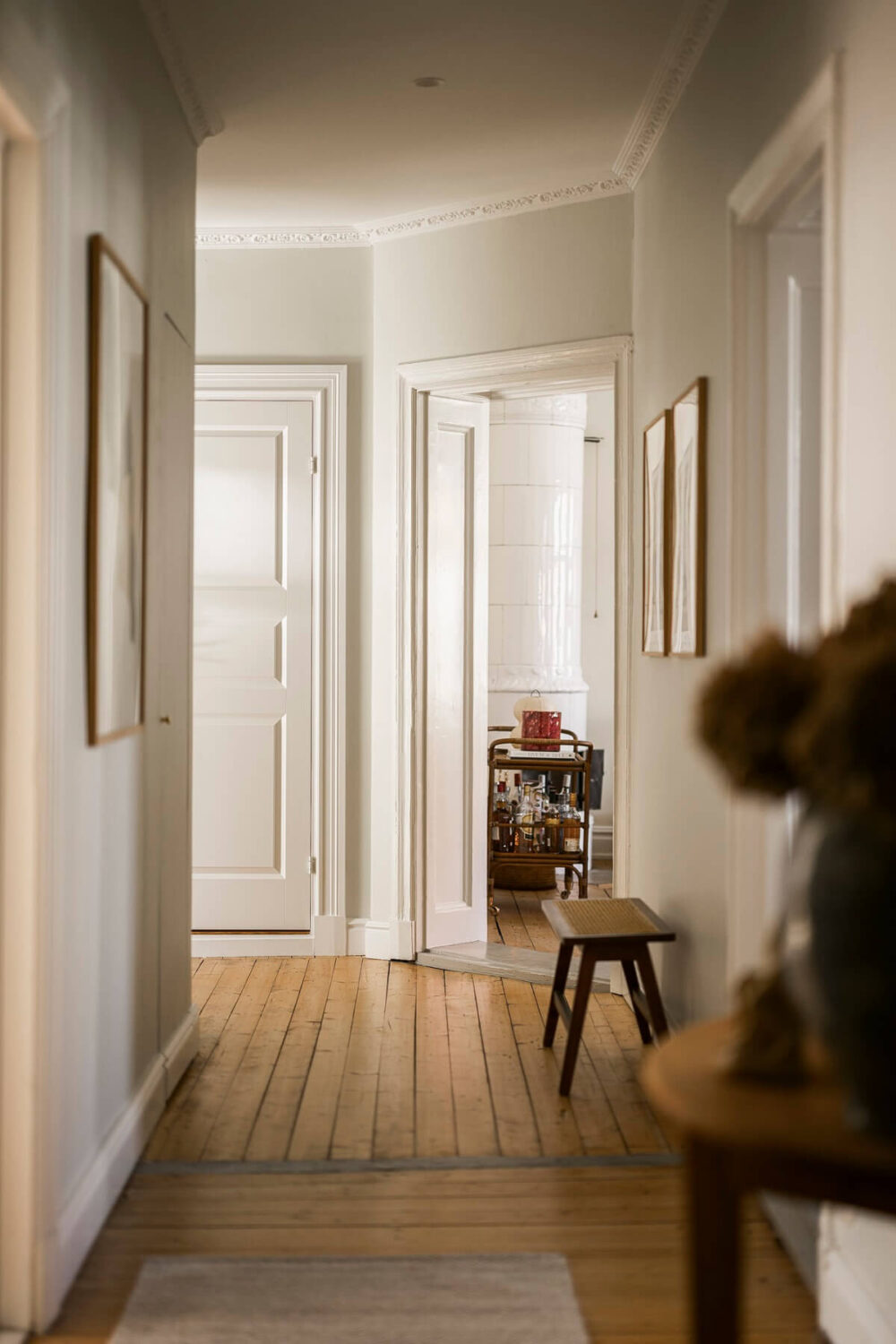 Hannes Mauritzson's Warm Yellow Hygge Apartment in Sweden 35 light green hallway wooden floor