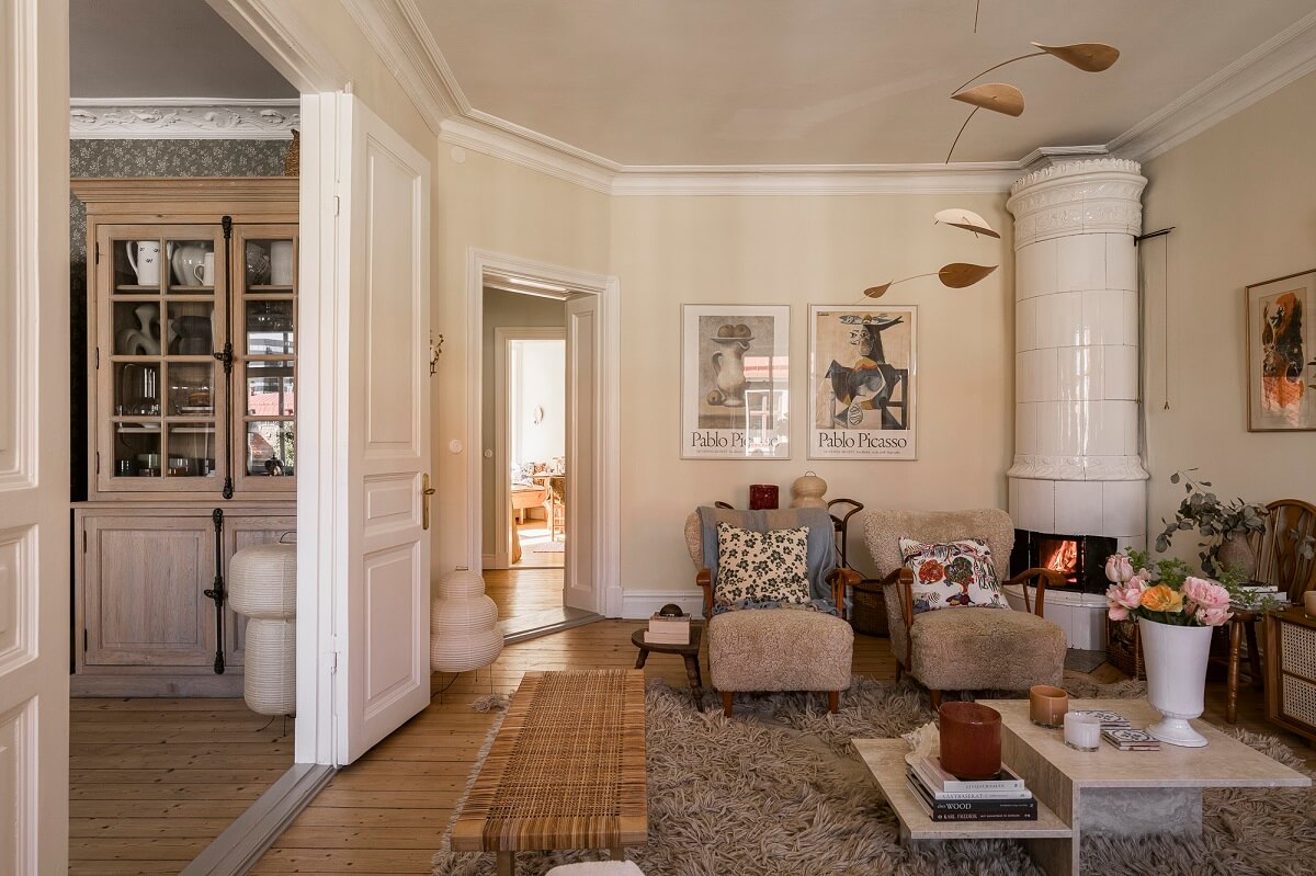 Hannes Mauritzson's Warm Yellow Hygge Apartment in Sweden 6 light yellow living room with fireplace