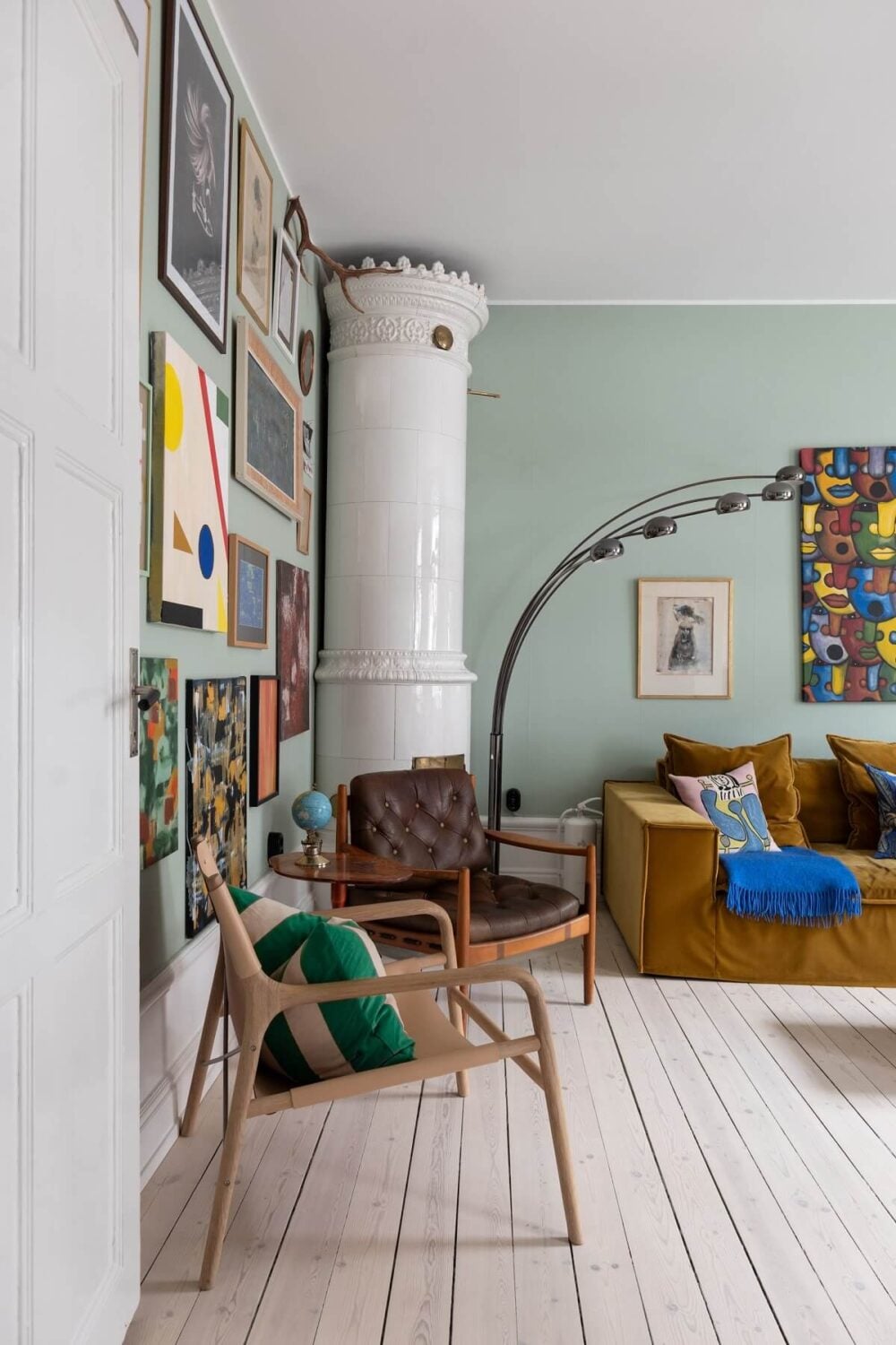Colorful Art and Furniture in a Stylish Scandi Apartment 4 living room detail fireplace