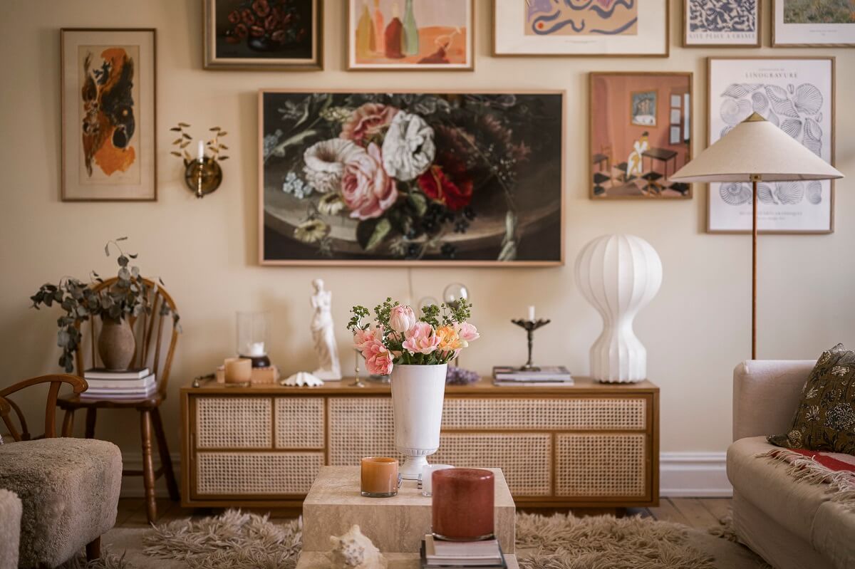 Hannes Mauritzson's Warm Yellow Hygge Apartment in Sweden 5 living room gallery wall with television