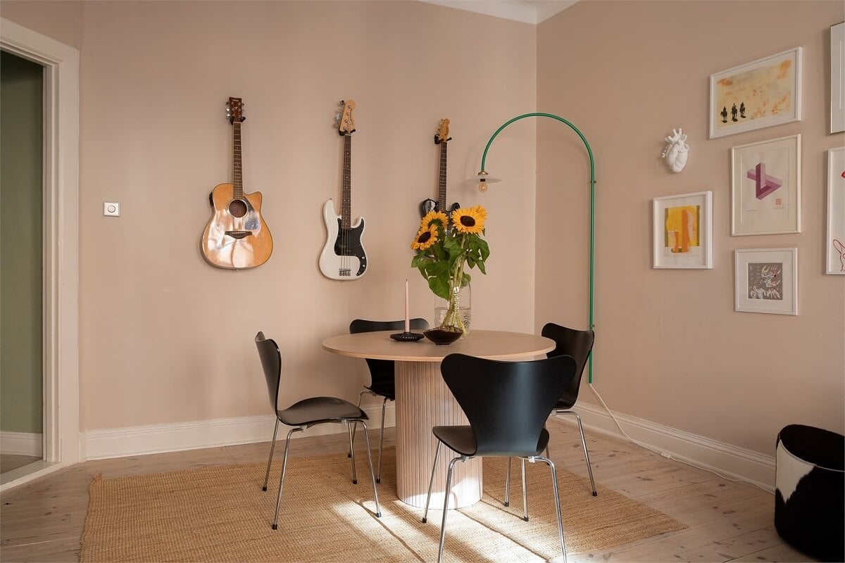 Nature-Inspired Colors in a Charming Stockholm Apartment 8 living room round dining table black chairs