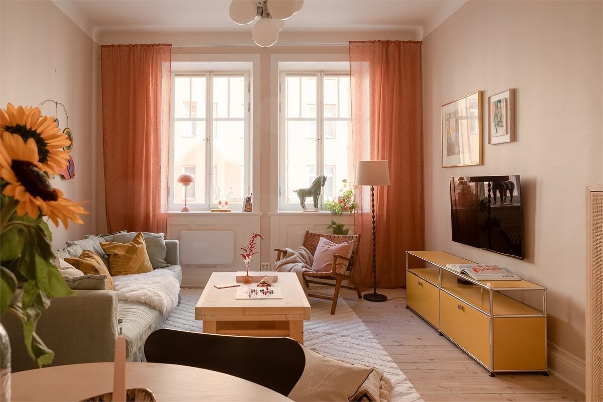 Nature-Inspired Colors in a Charming Stockholm Apartment 2 living room terracotta colored curtains
