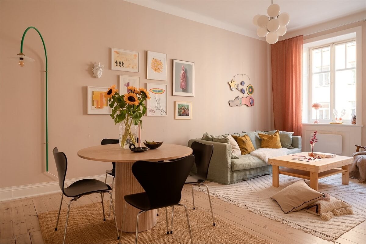 Nature-Inspired Colors in a Charming Stockholm Apartment 6 living room terracotta curtains round dining table