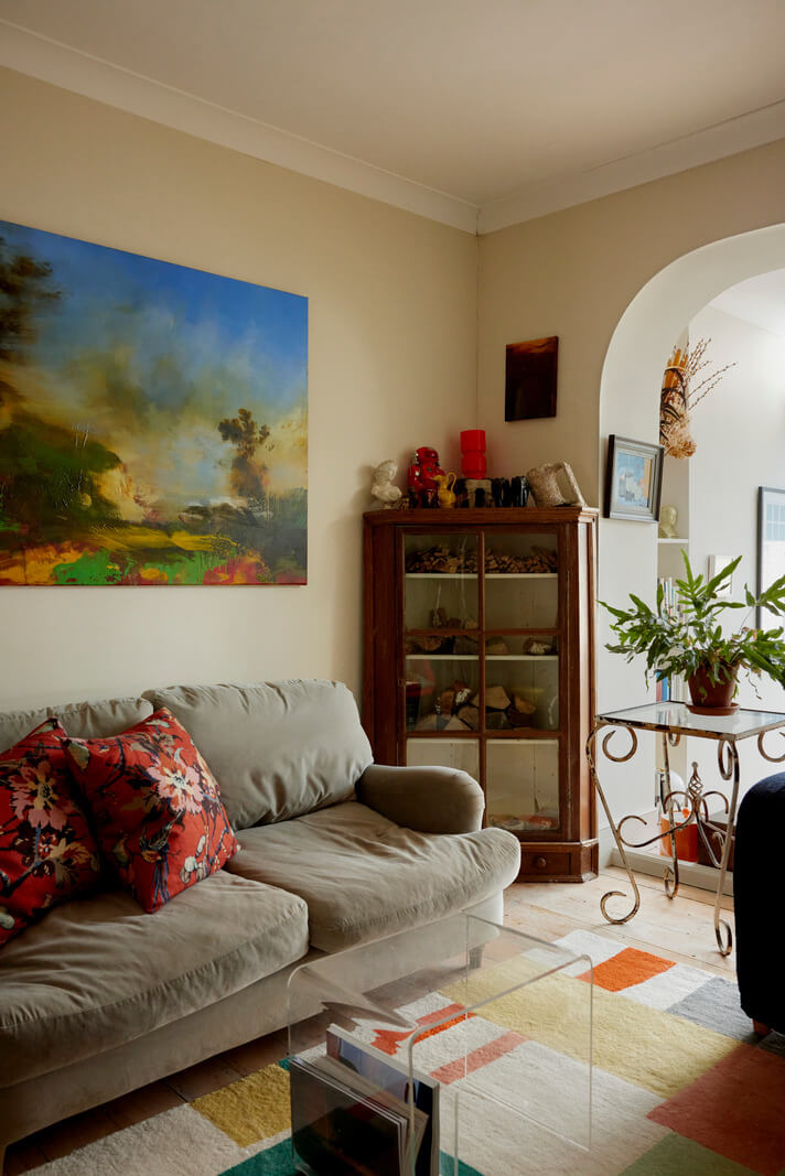 Muted Tones and an Orangery in a Victorian Coastal House 3 living room with colorful rug