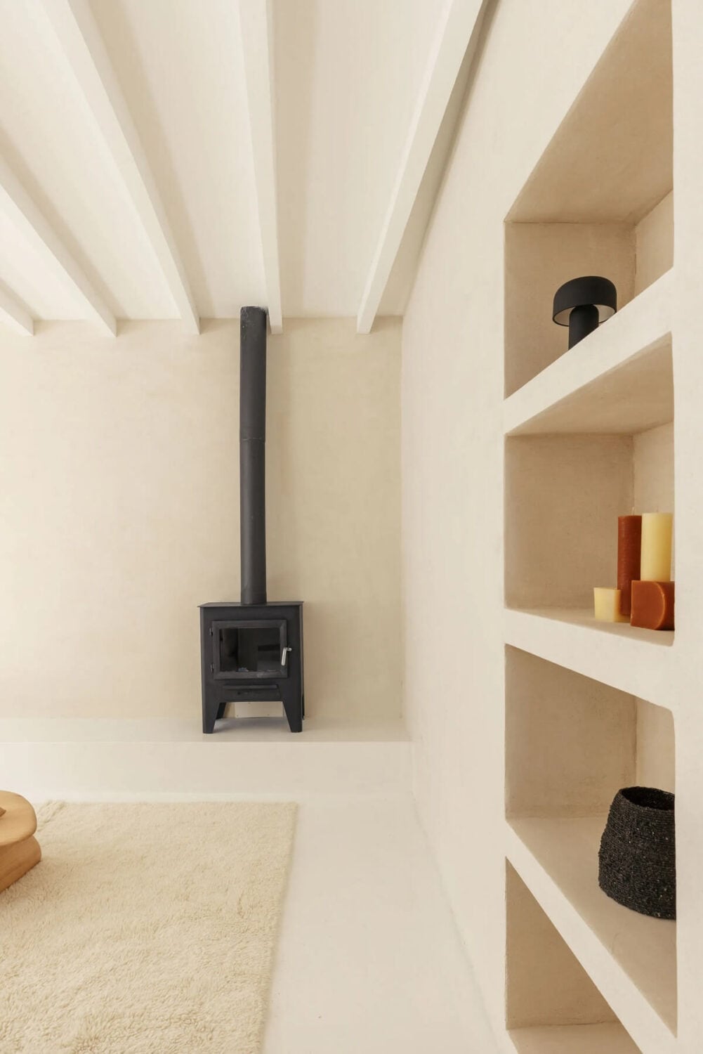 A Serene Minimalistic Townhouse in Portugal 4 living room wood burner