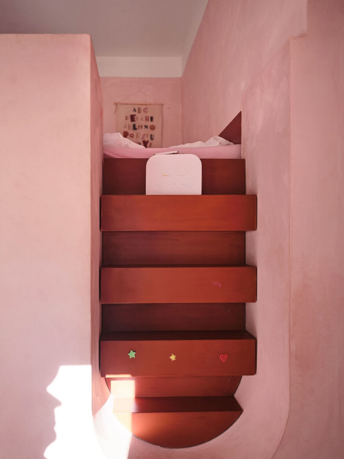 A Light Pastel Yellow and Pink Apartment in Stockholm 23 loft bed stairs