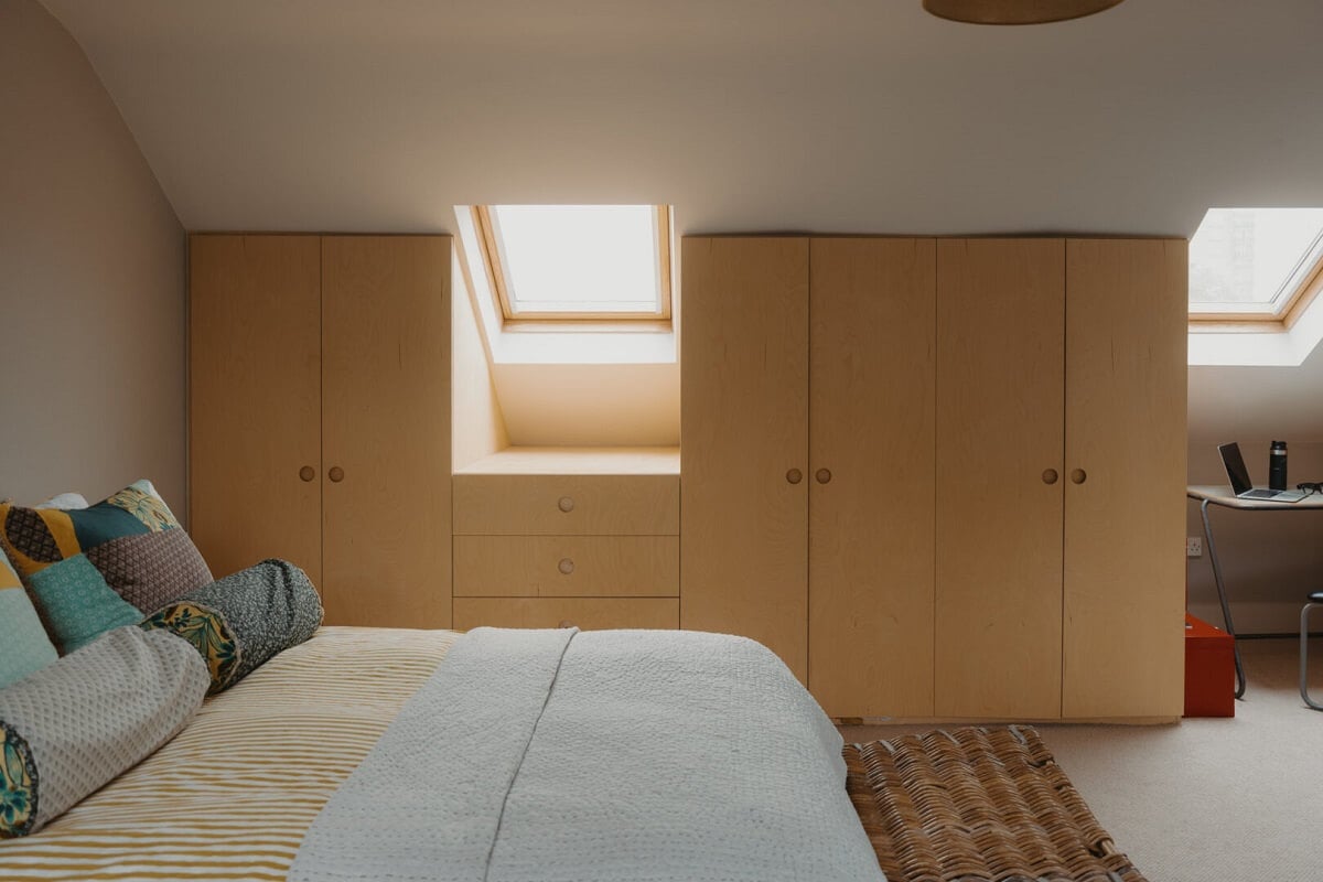 Original Details and a Modern Extension in a London House 30 loft bedroom with wardrobes under slanted ceiling