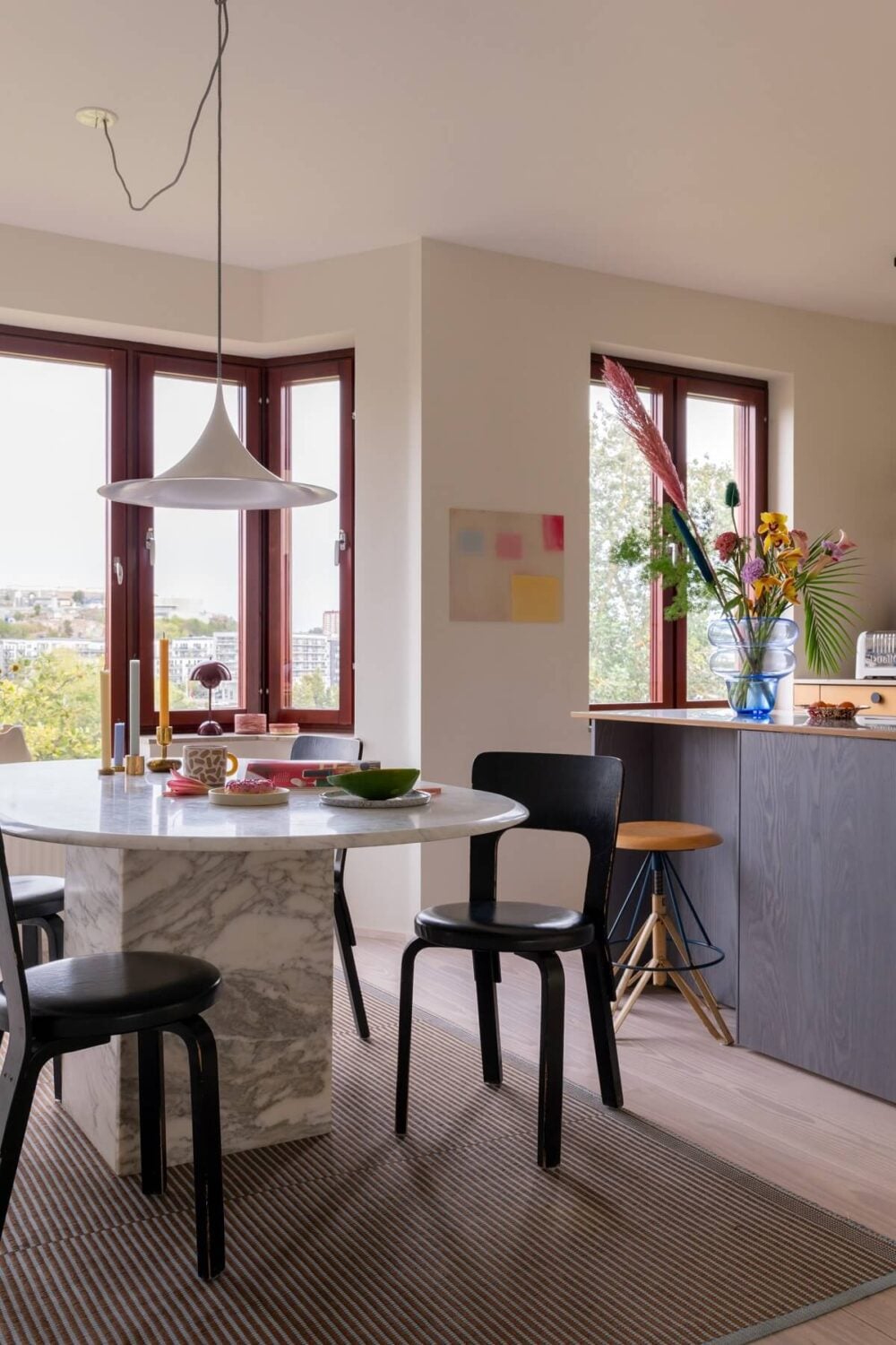 A Light and Modern Stockholm Apartment with Cheerful Color Accents 6 marble-dining-table.jpg