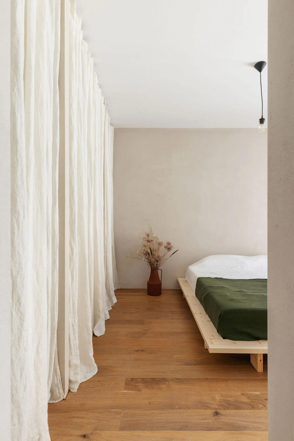 A Serene Minimalistic Townhouse in Portugal 11 minimalistic bedroom wooden ceiling
