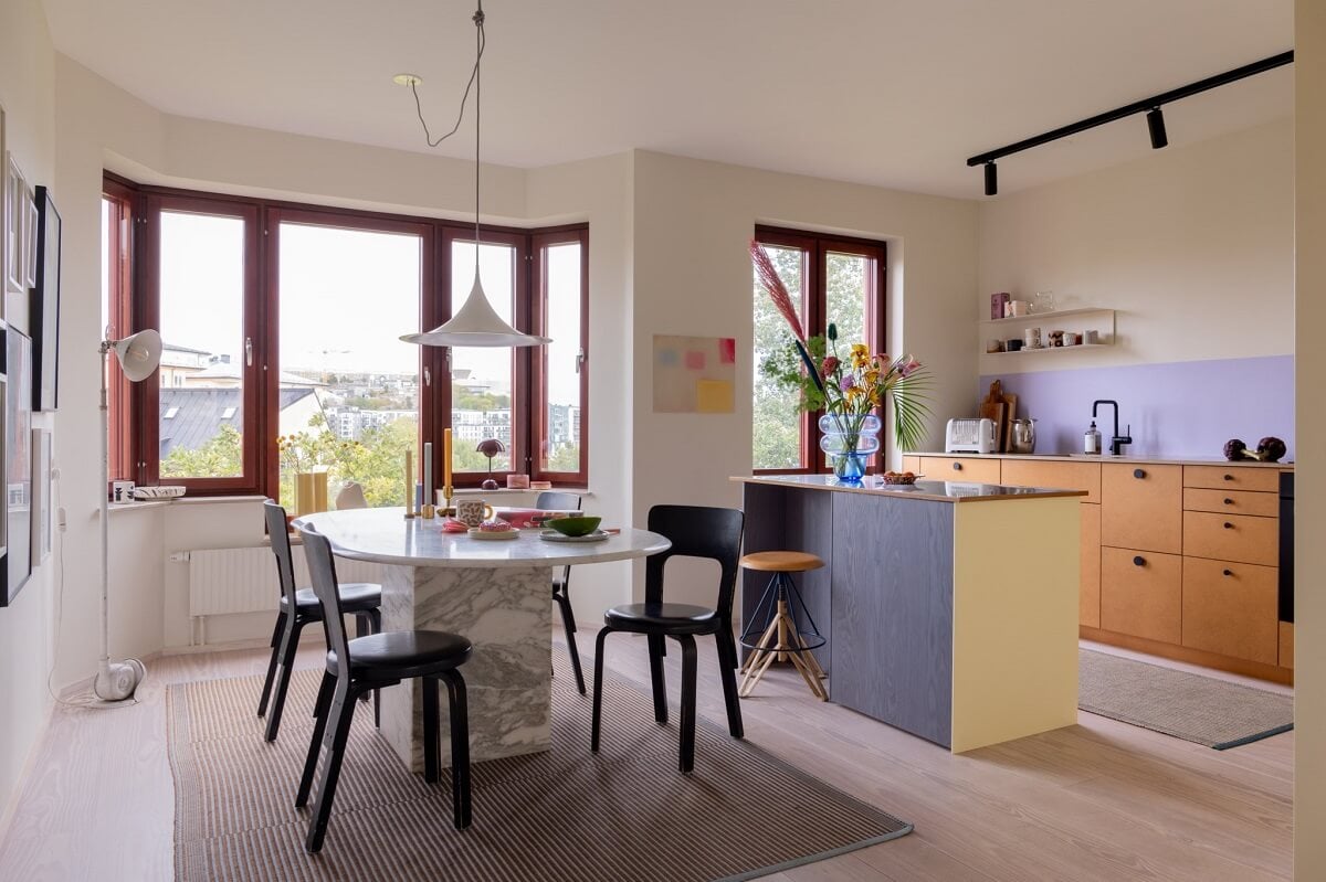 A Light and Modern Stockholm Apartment with Cheerful Color Accents 1 modern kitchen and dining area