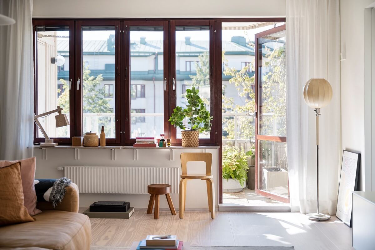 A Light and Modern Stockholm Apartment with Cheerful Color Accents 9 modern living room with balcony