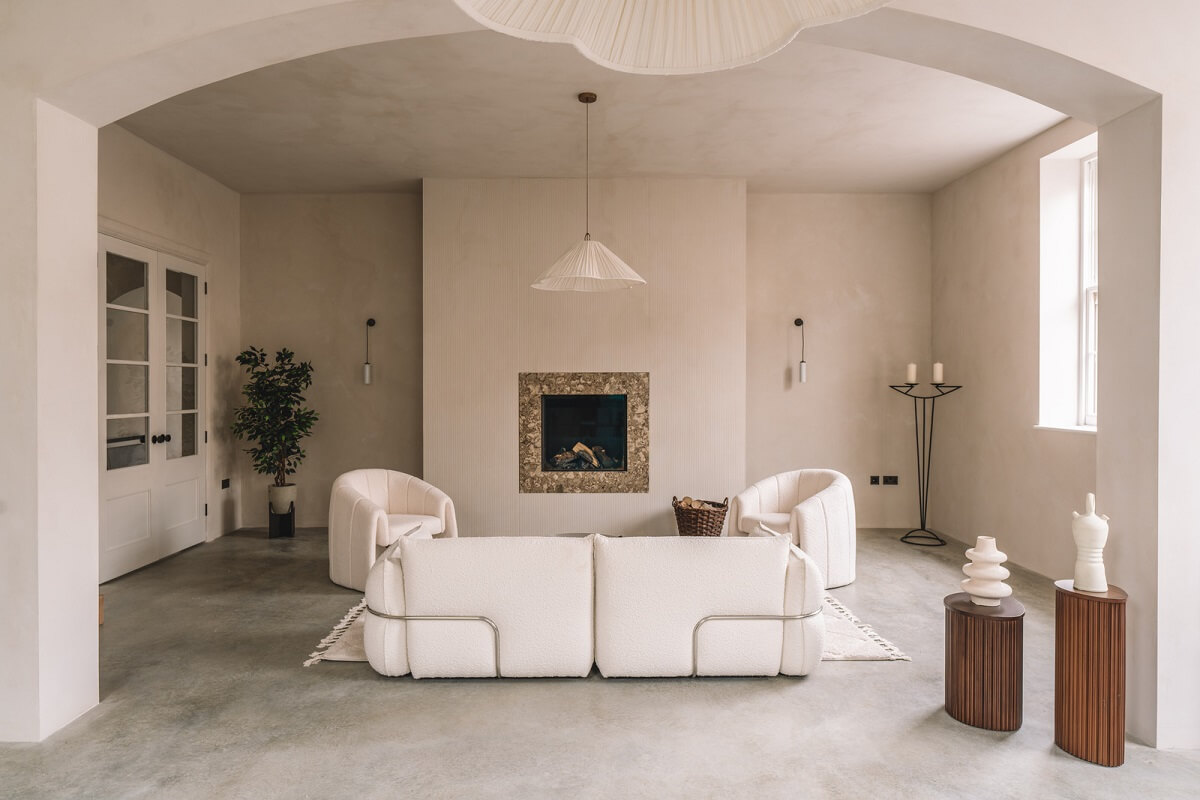 Contemporary Interiors with Limewash Walls in an Old School Building 7 neutral colored living room with white furniture