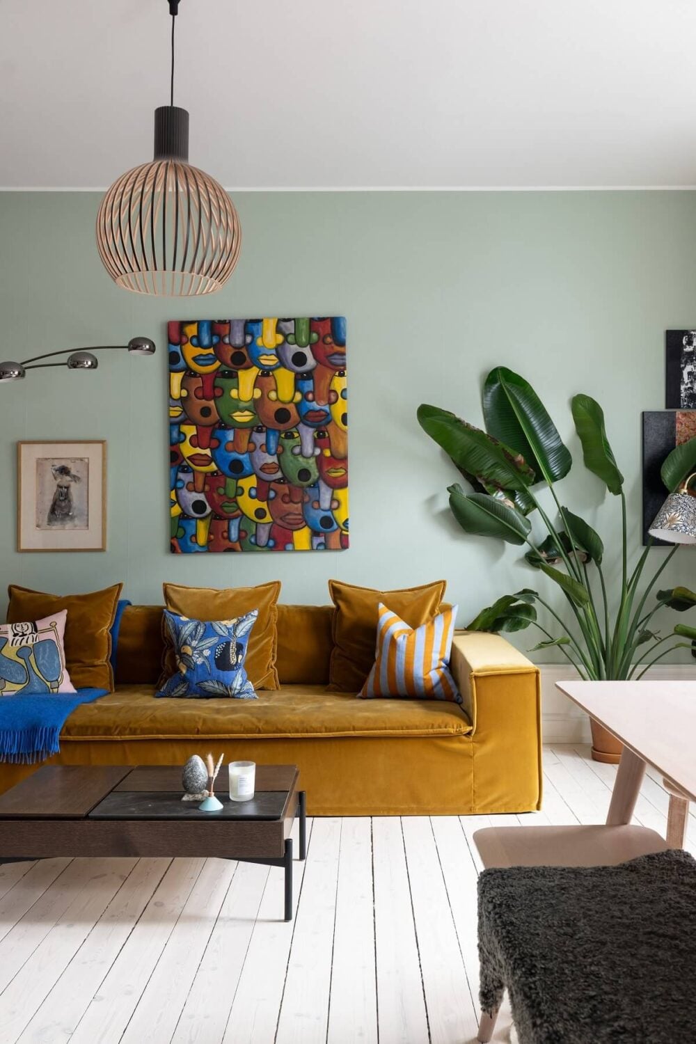 Colorful Art and Furniture in a Stylish Scandi Apartment 2 ochre sofa