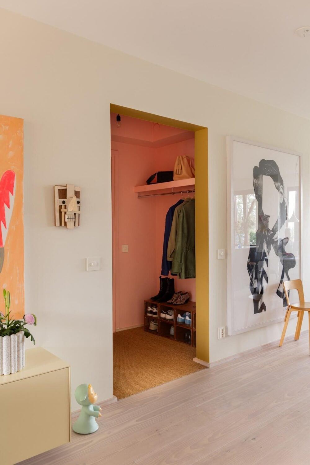 A Light and Modern Stockholm Apartment with Cheerful Color Accents 16 open doorway pink hall A Light and Modern Stockholm Apartment with Cheerful Color Accents