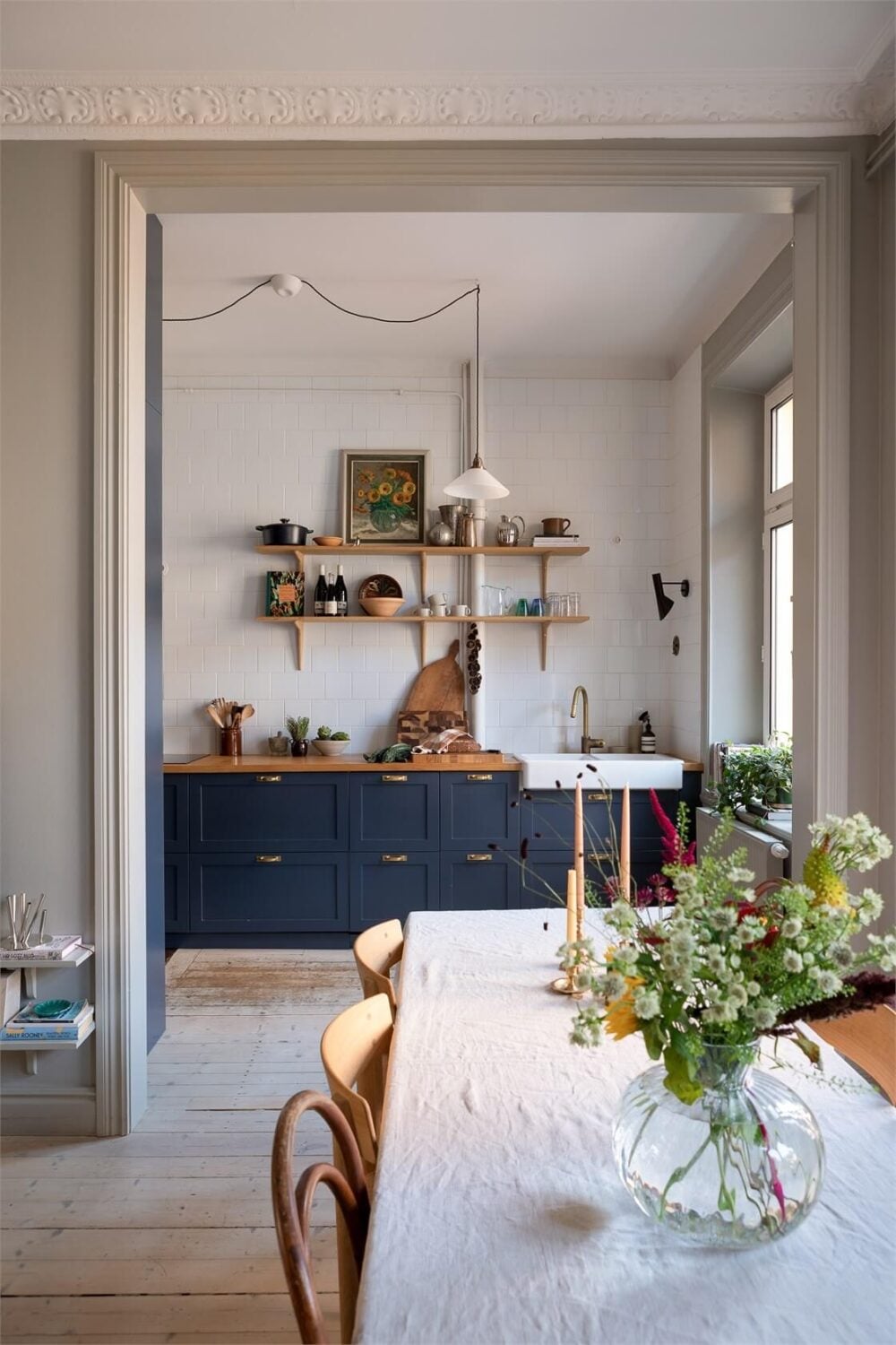 A Turn-of-the-Century Apartment with a Dark Blue Bedroom - Revisited 11 open floor plan living room kitchen