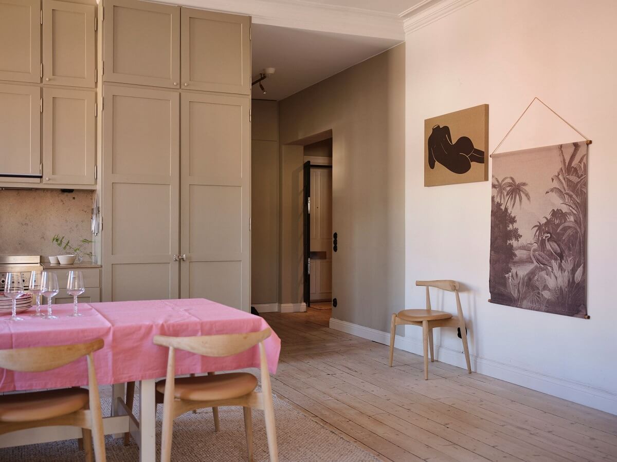 A Light Pastel Yellow and Pink Apartment in Stockholm 17 open kitchen layout with hall