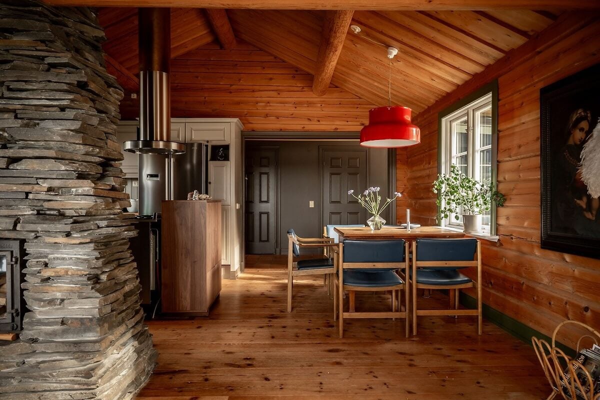 A Warm Scandinavian Log House with a Green Roof 9 open living room kitchen swedish log house