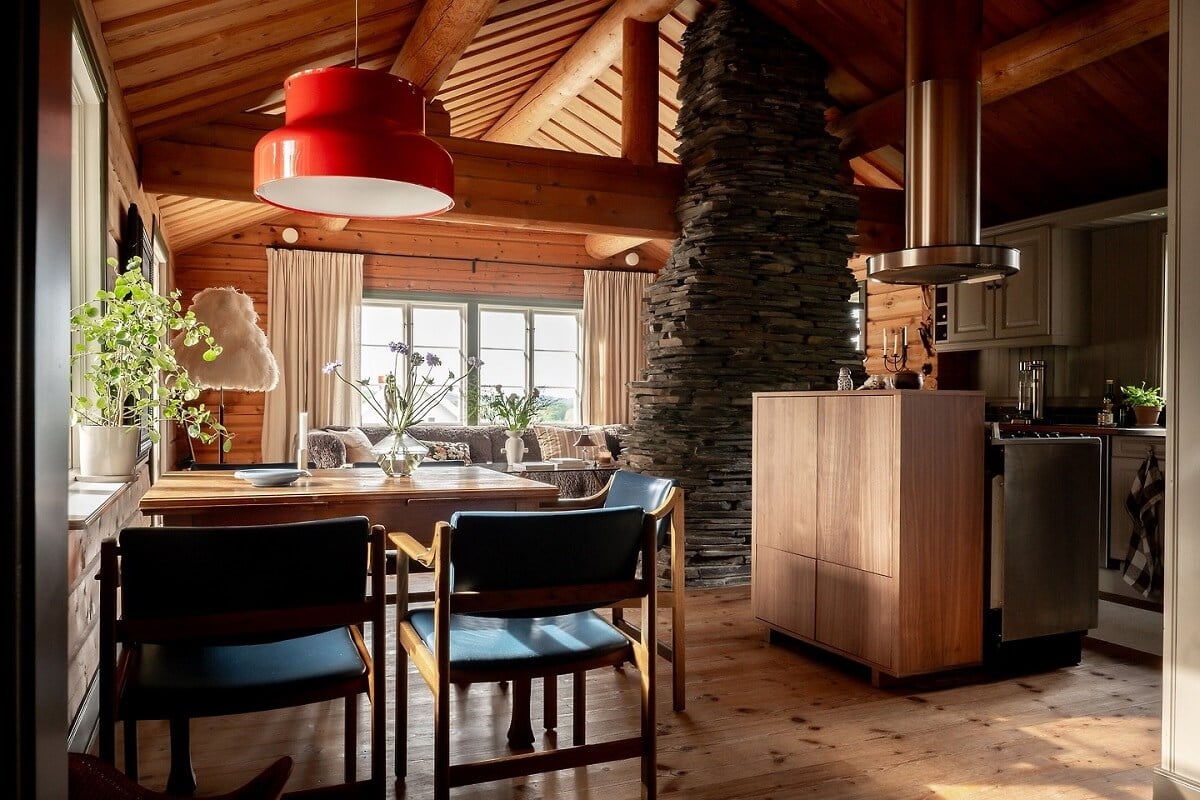 A Warm Scandinavian Log House with a Green Roof 11 open plan kitchen pitched ceiling