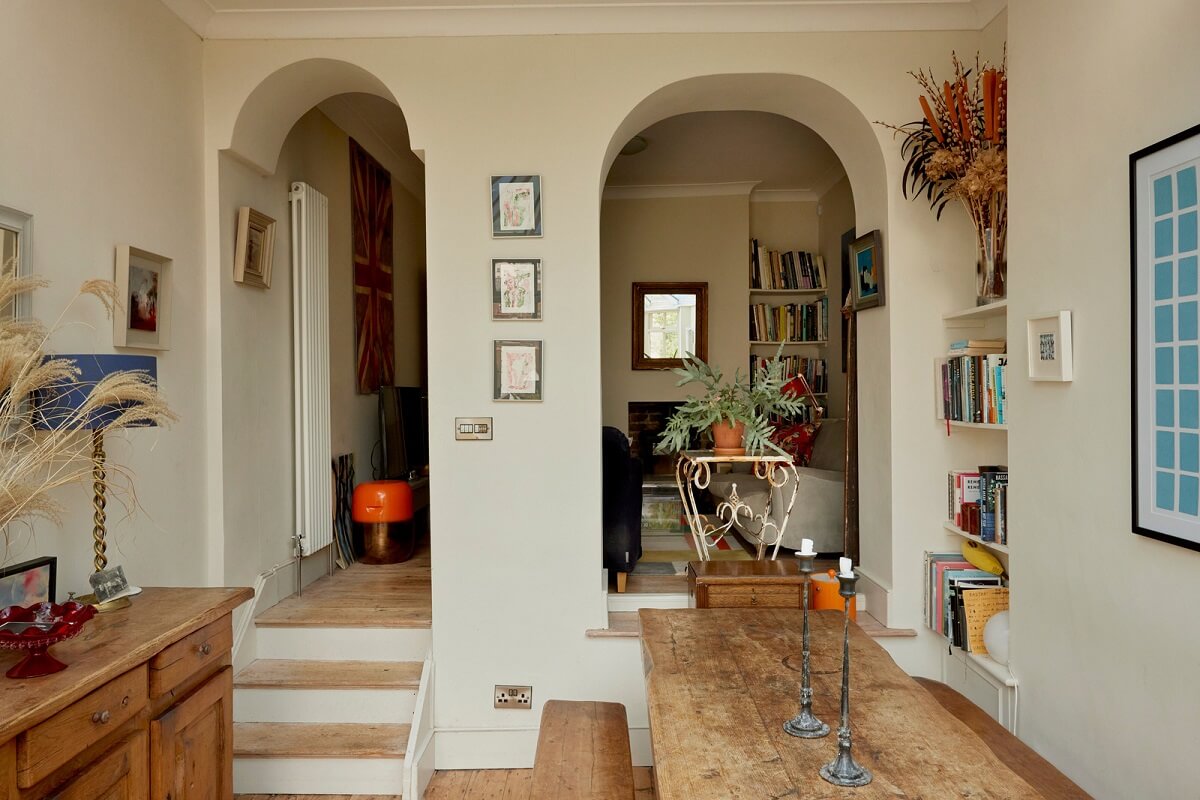 open plan living and dining room with arches