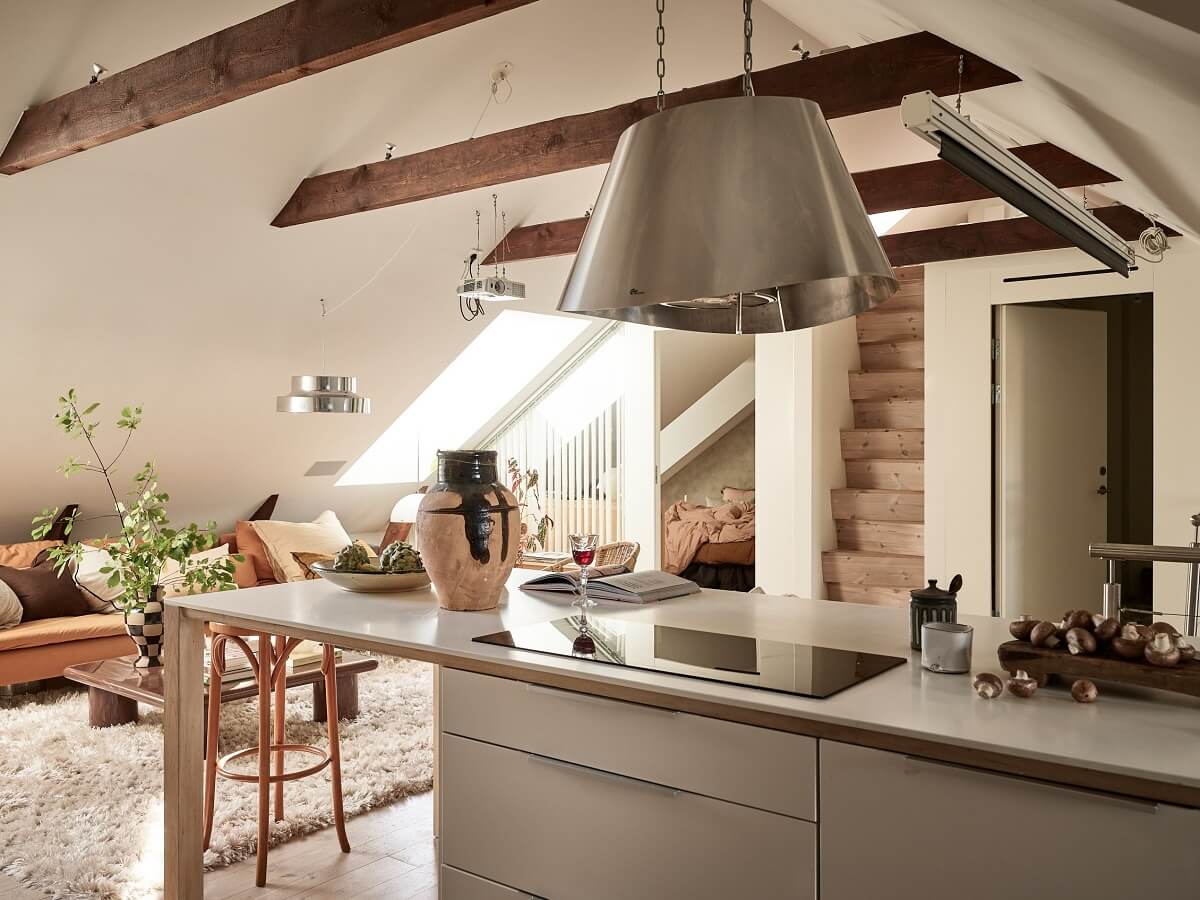 A Light Two-Bedroom Attic Apartment in Sweden 8 open plan living room kitchen wooden beams