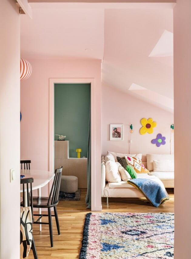 A Small, Colorful Attic Apartment with A Yellow Kitchen 16 pink attic living room