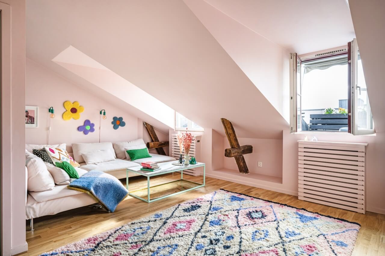 A Small, Colorful Attic Apartment with A Yellow Kitchen 1 pink living room colorful rug