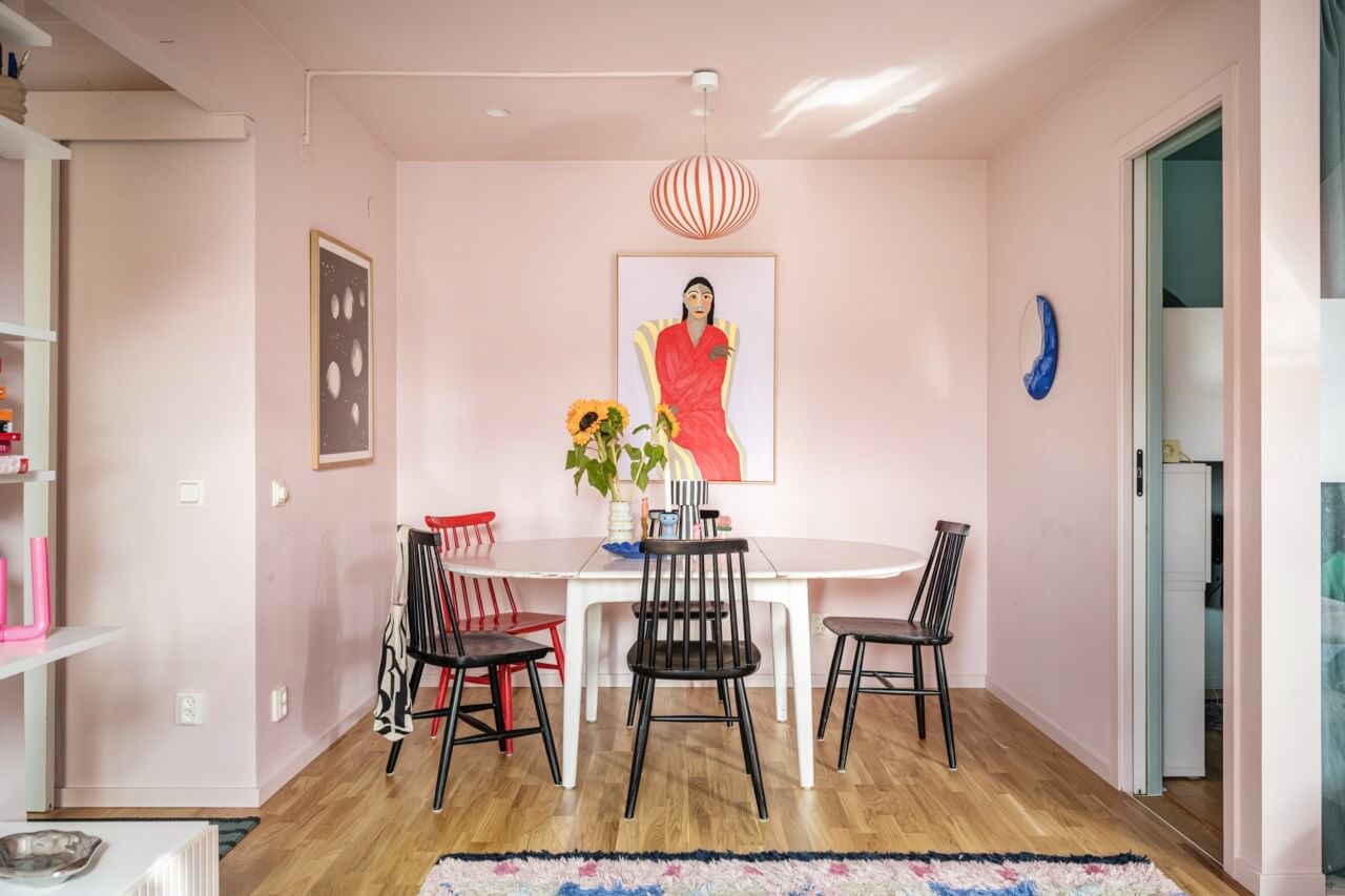 A Small, Colorful Attic Apartment with A Yellow Kitchen 5 pink living room with dining space