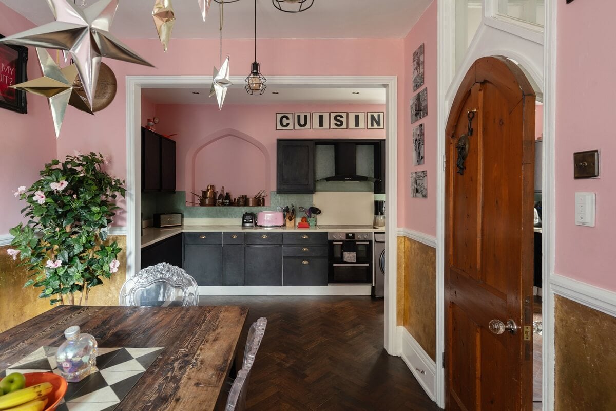 pink open plan dining room kitchen